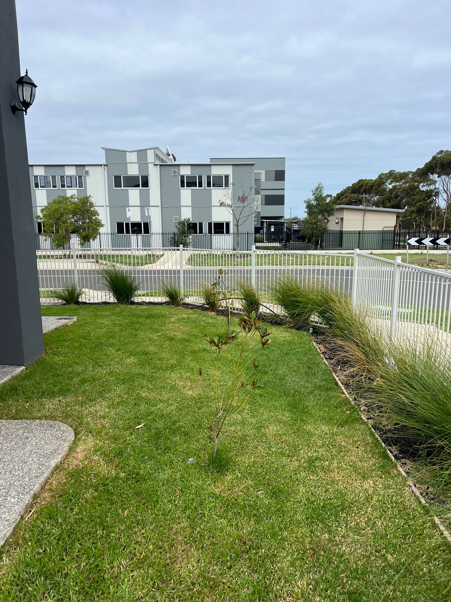 Finished white aluminium fence on new estate, Point Cook