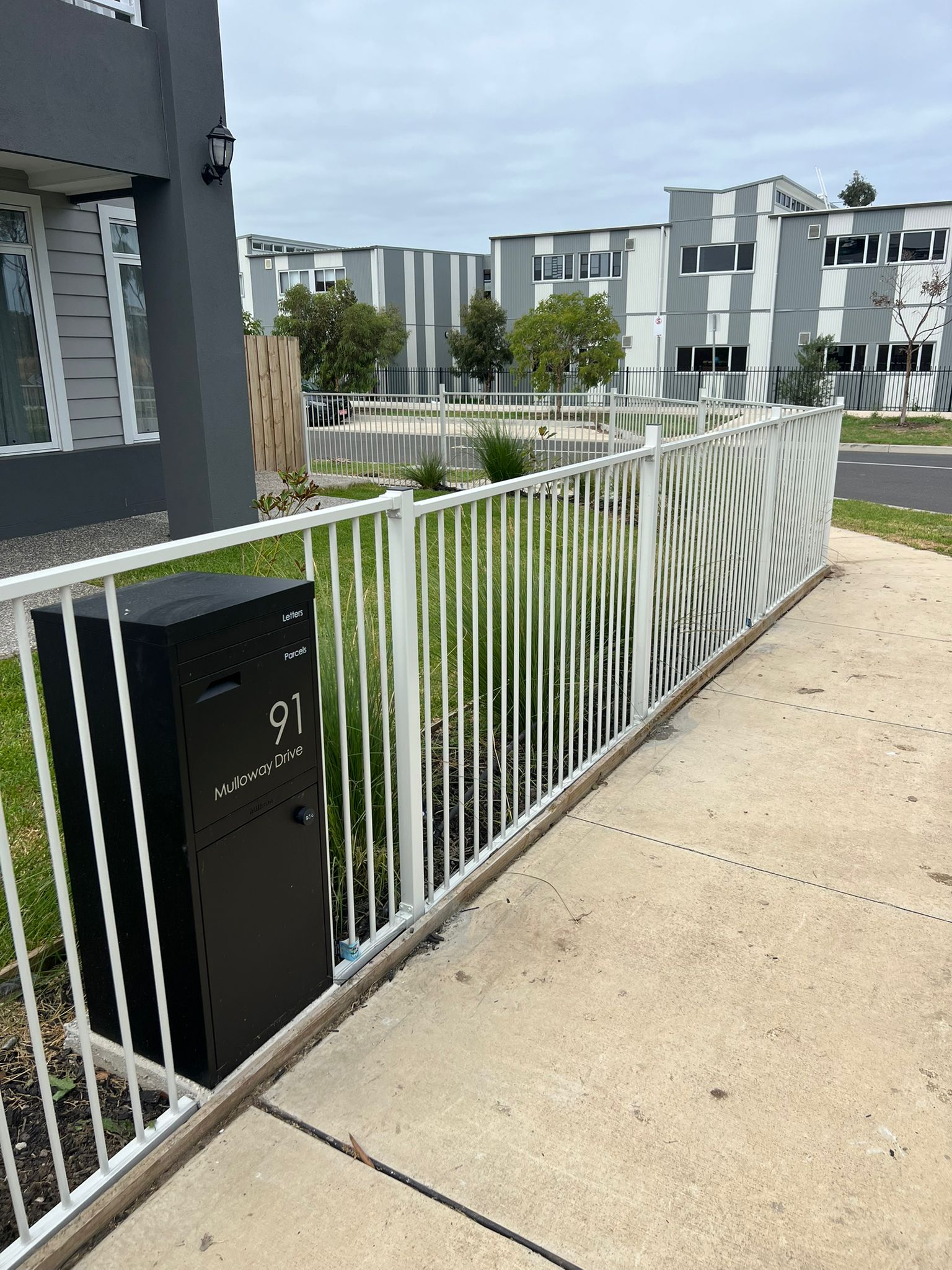 White tubular aluminium pool-style fence, Point Cook