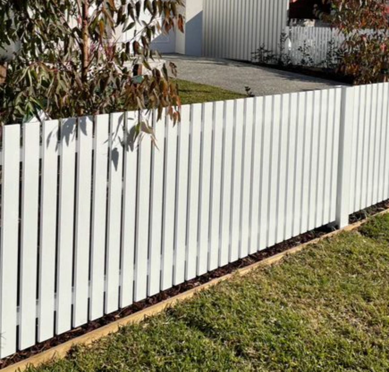 Modern white slat picket fence, Laverton