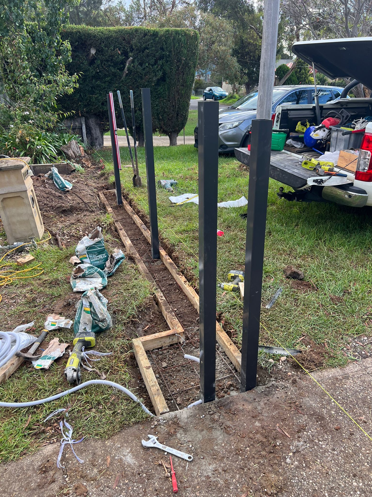New posts being set for an aluminium sliding gate, Werribee