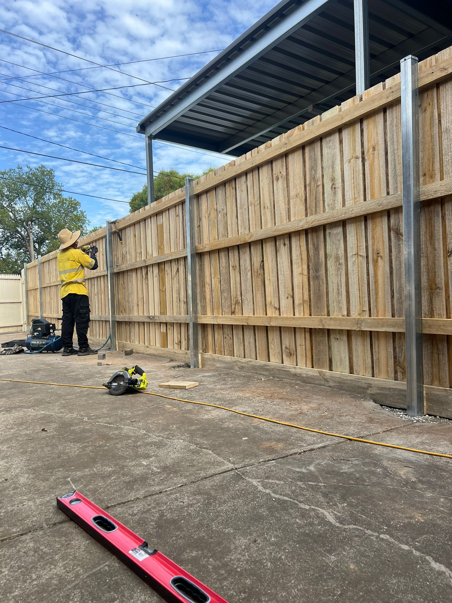 Timber paling install in progress, Sunshine